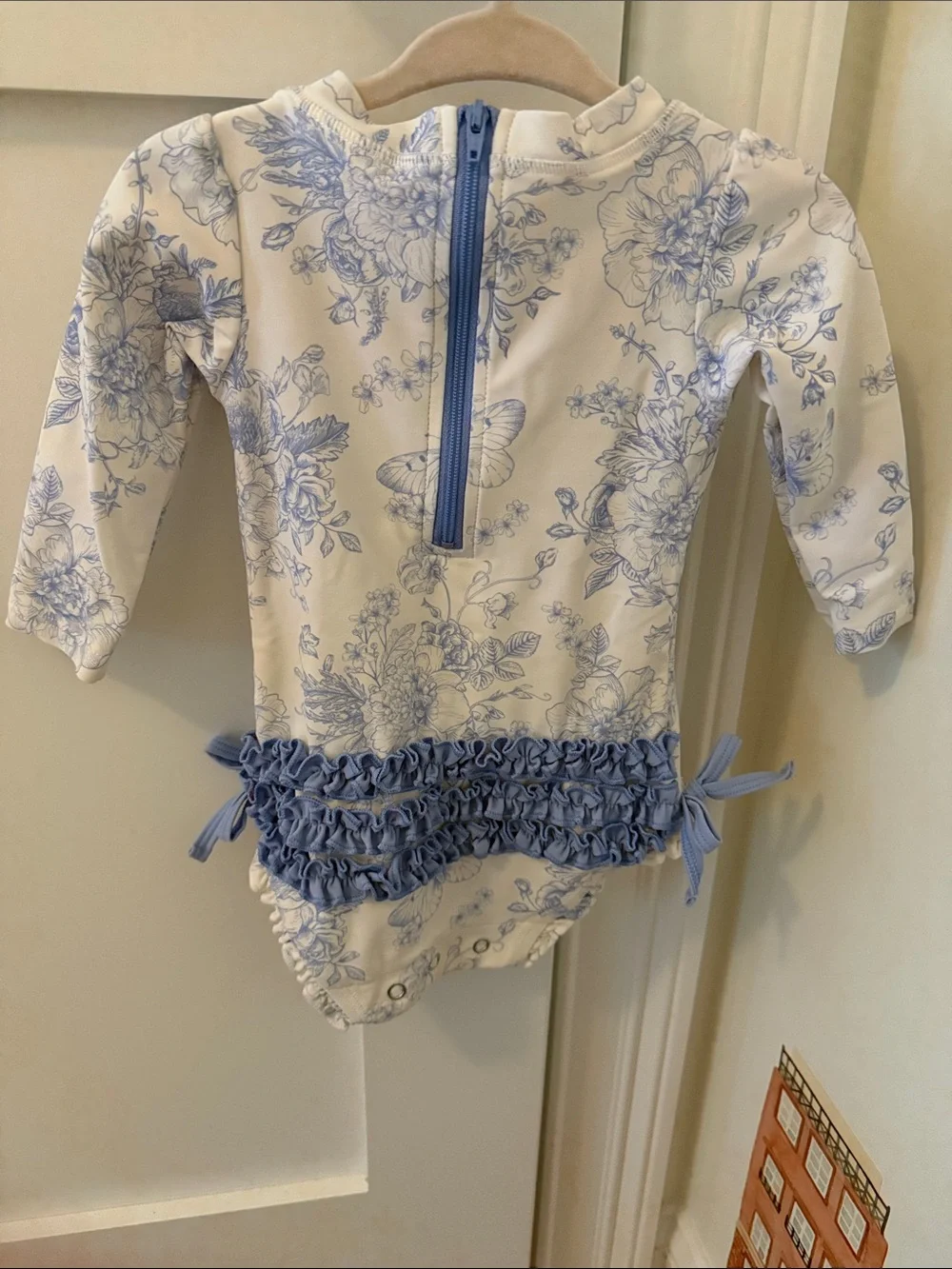 Ruffle Butts Cream and Blue Floral One-Piece with Bows